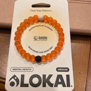 Beautiful brand new Lokai bracelet size medium gorgeous orange color